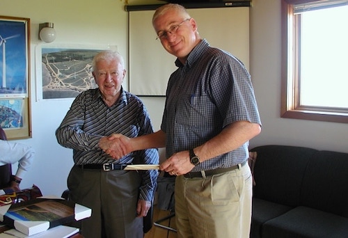 Jack Templin shaking hands with Carl Brothers, a previous Templin award winner