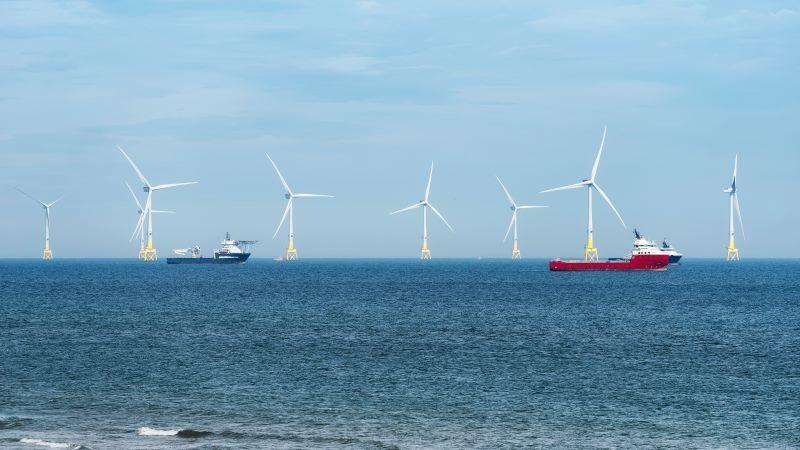Windmills and ships in the sea