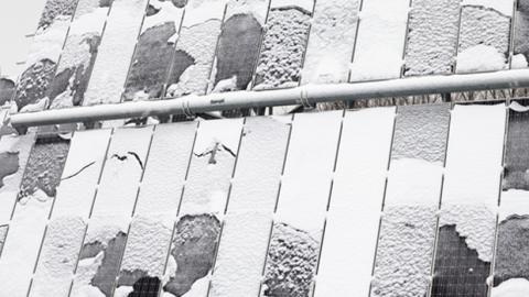 Solar panels with snow and ice