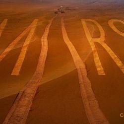 Journey to Mars - rover has written "Mars" with tire tracks